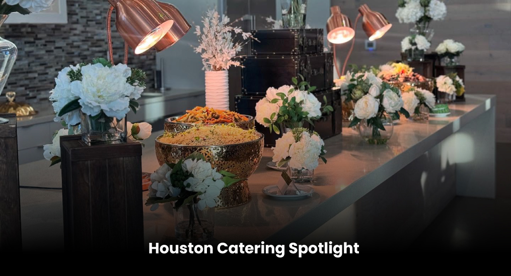 Elegant Houston catering display with food and floral arrangements.